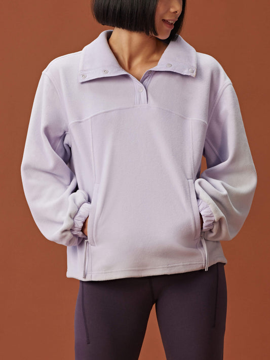 woman in light purple fleece sweatshirt