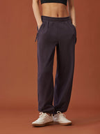 woman in dark purple pants