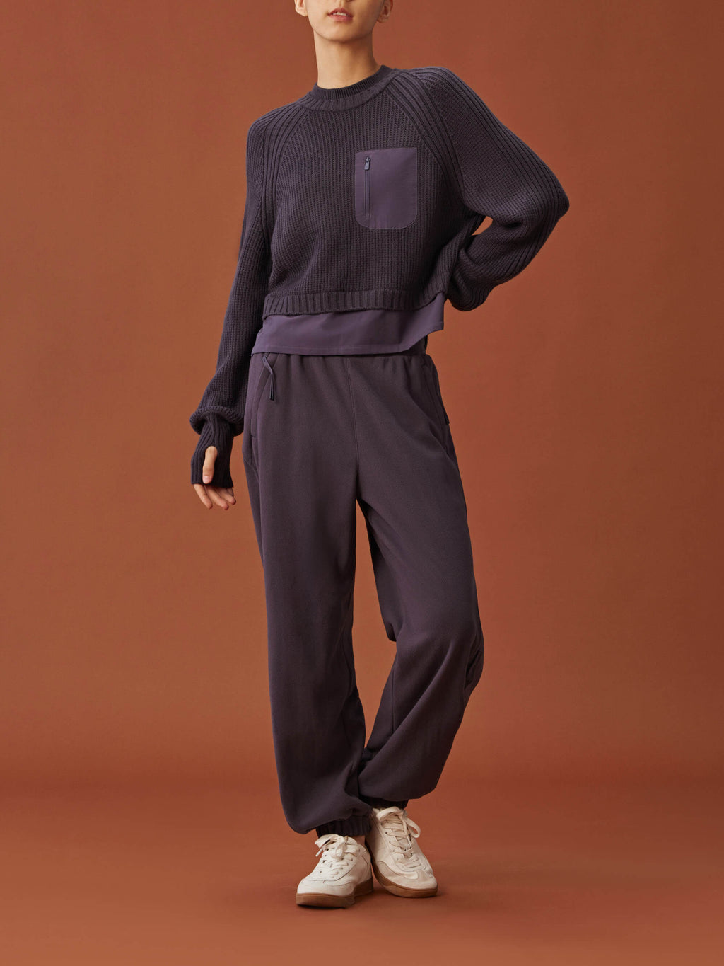 woman in dark purple sweater and  pants