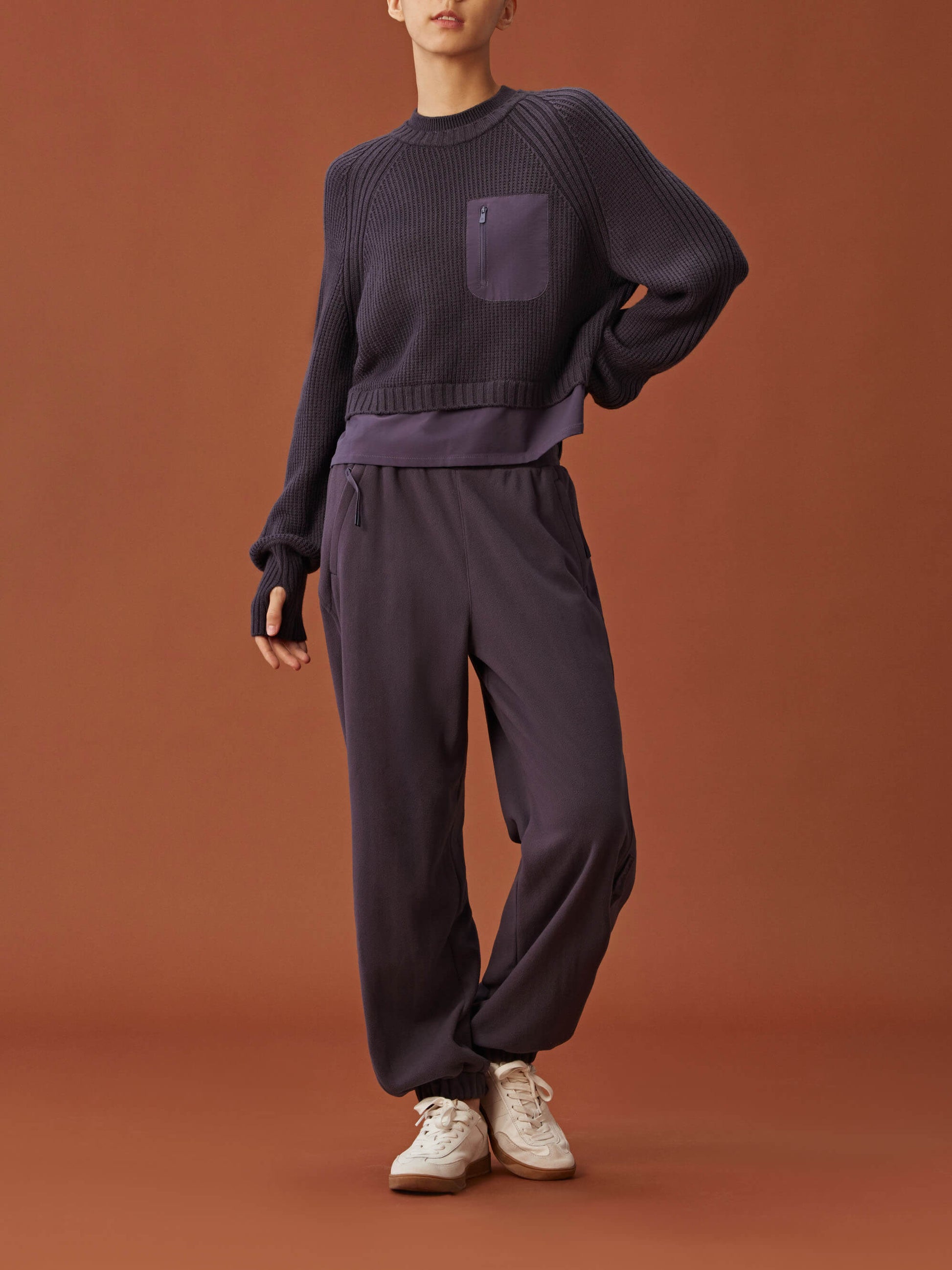 woman in dark purple sweater and  pants