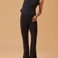 woman in black crew neck sleeveless top and black flare pants