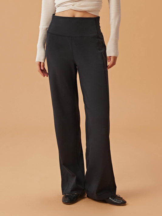 woman in black wide leg pants