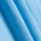 A close-up view of the light blue fabric of the training skort, showcasing its texture and smooth finish.