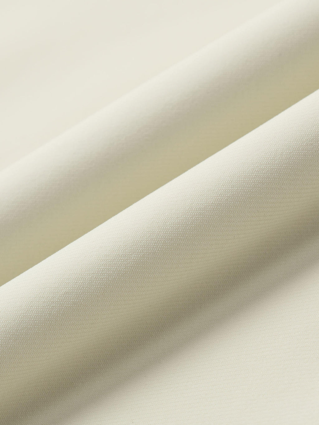 Close-up of beige fabric with a subtle texture