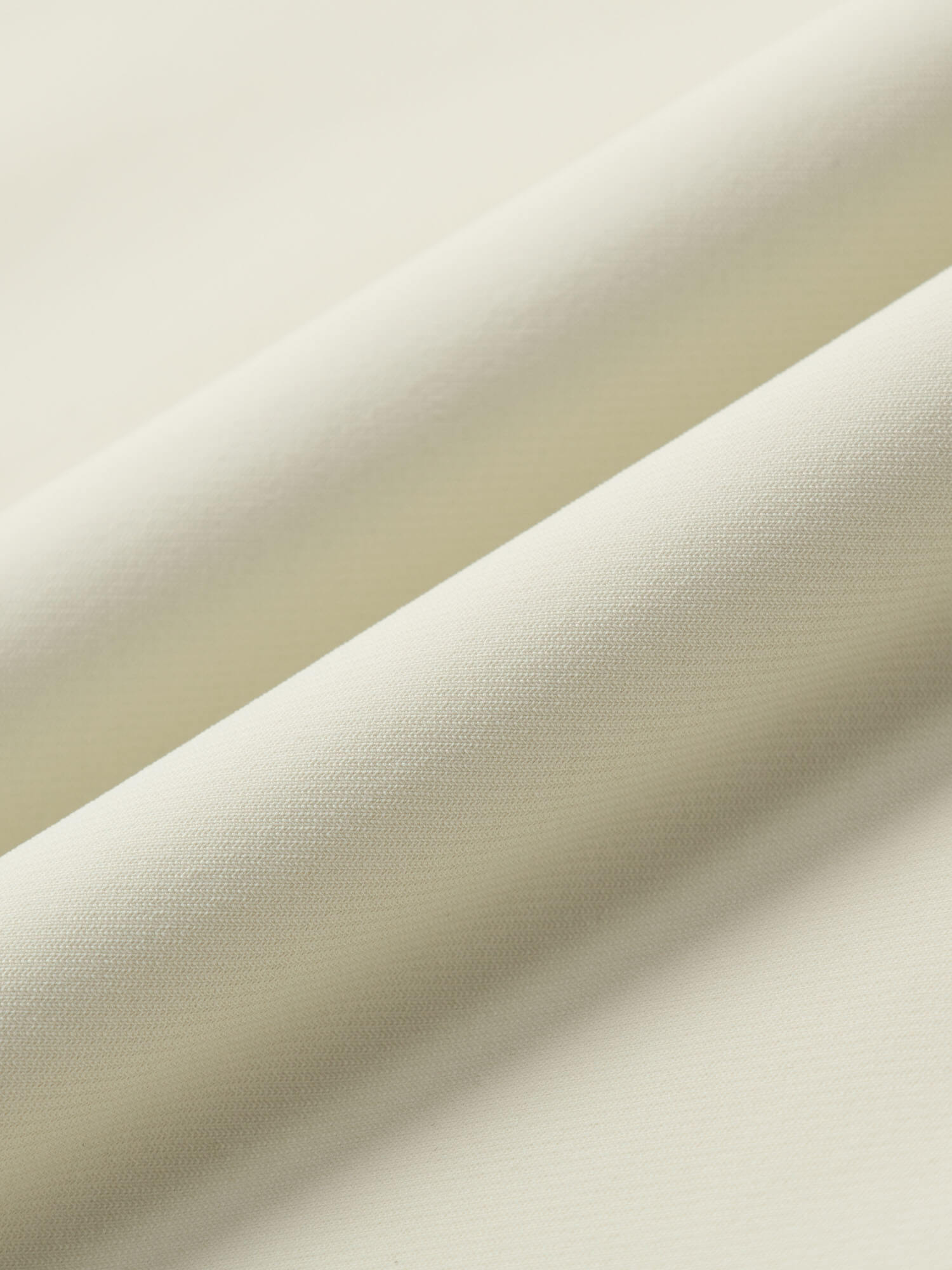 Close-up of beige fabric with a subtle texture