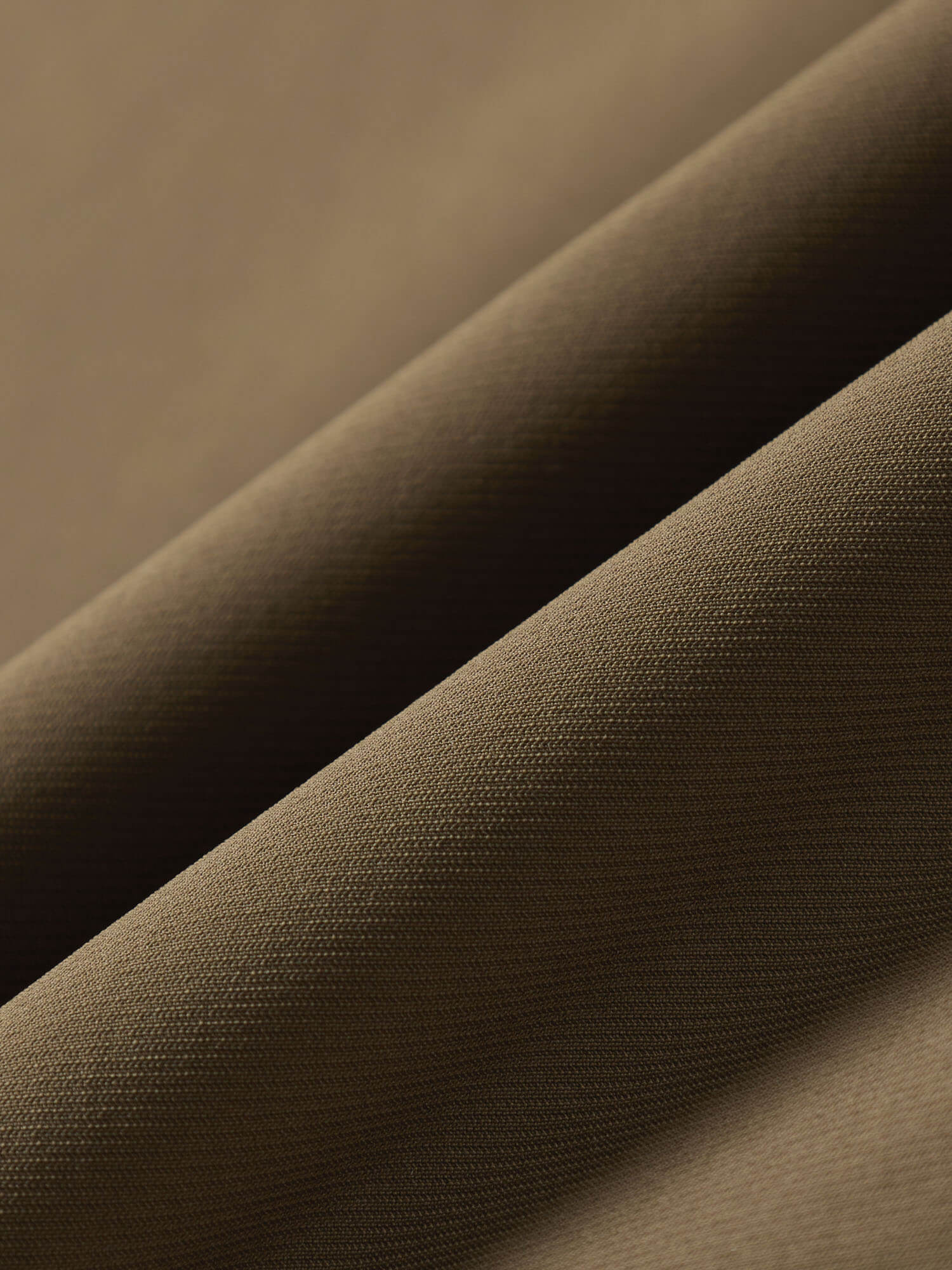 Close-up of brown fabric with a subtle texture