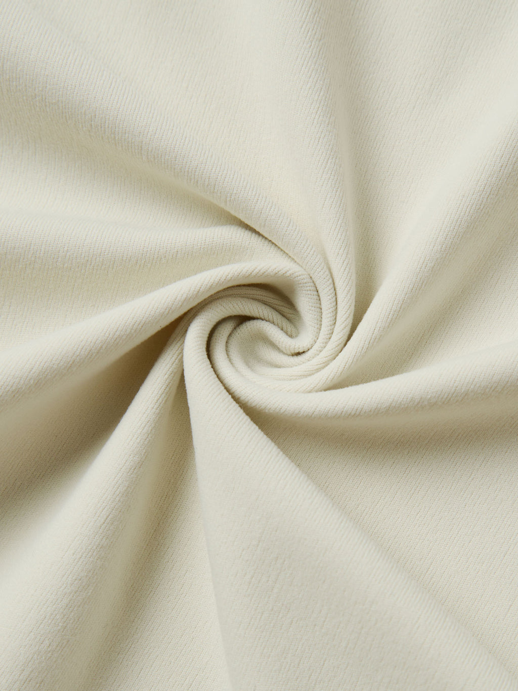 Close-up of beige fabric with a swirl pattern