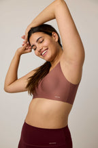 woman wearing brick color bra
