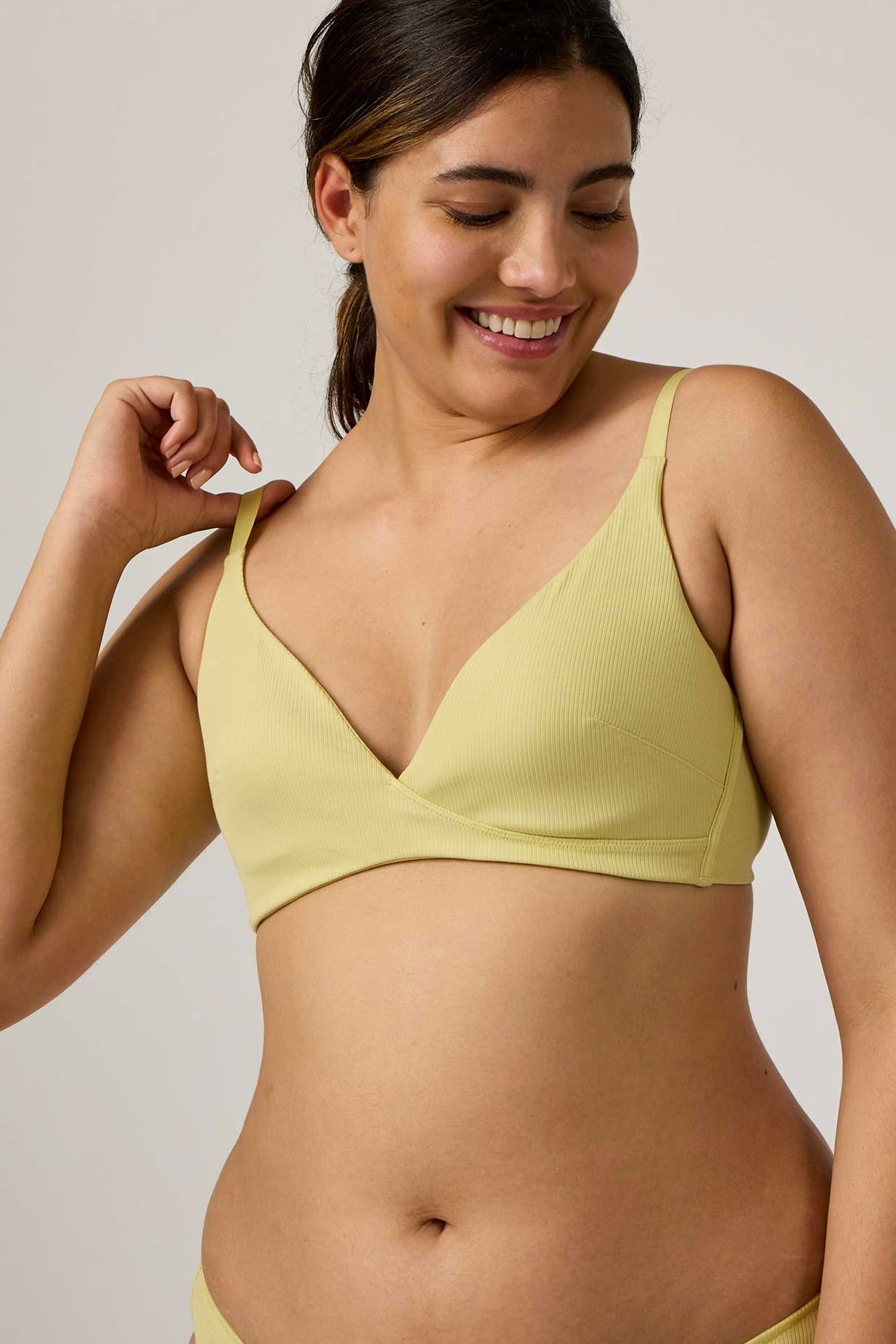 woman in lemon color bra