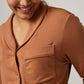 close up of woman in caramel pajama top