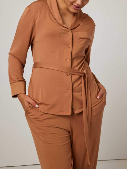 woman in caramel color pajama set