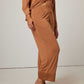 woman in caramel color pajama set