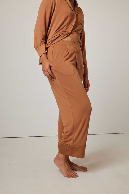 woman in caramel color pajama set