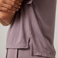 side close up of woman in purple pajama t-shirt and matching pants