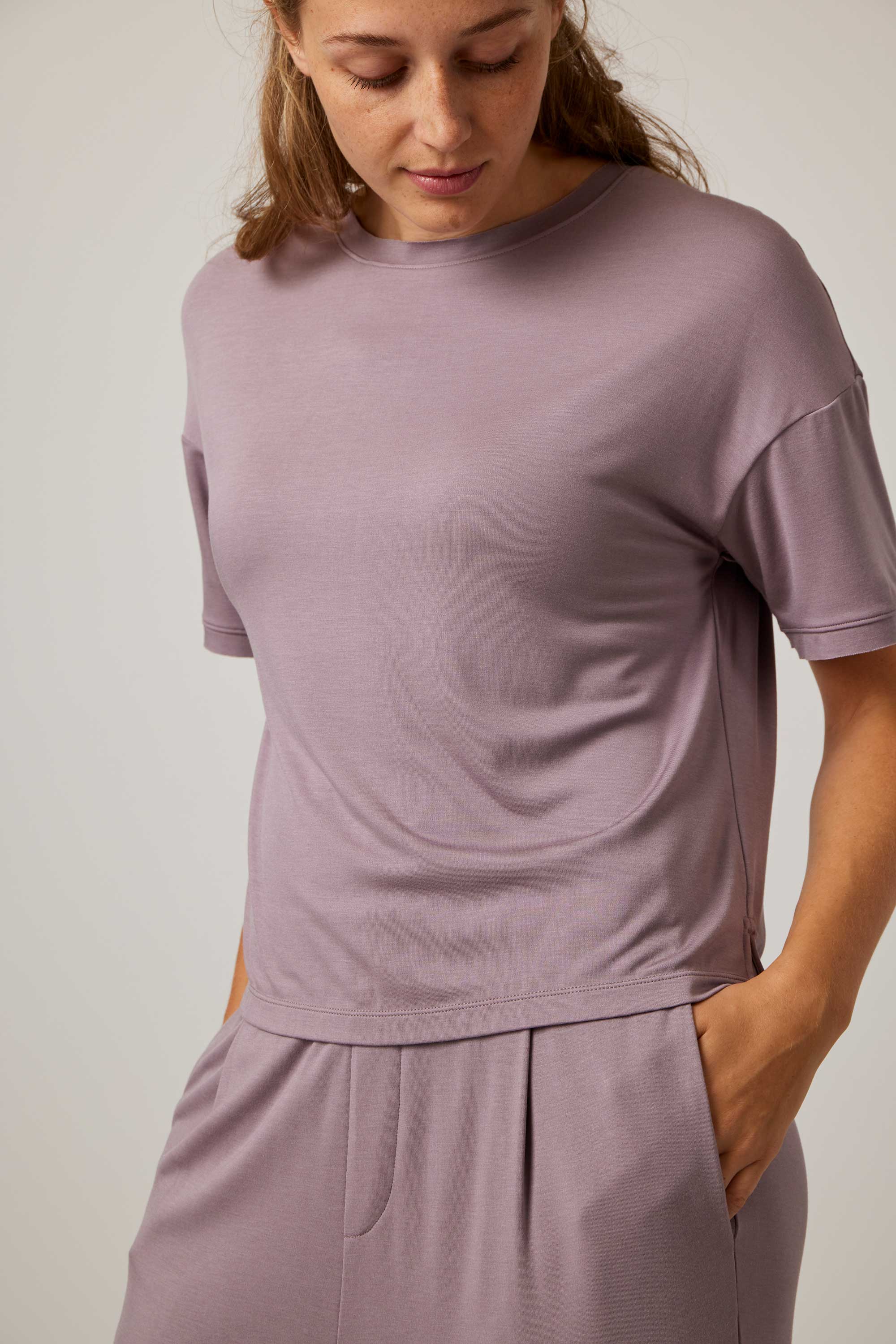 woman in purple pajama t-shirt and matching pants