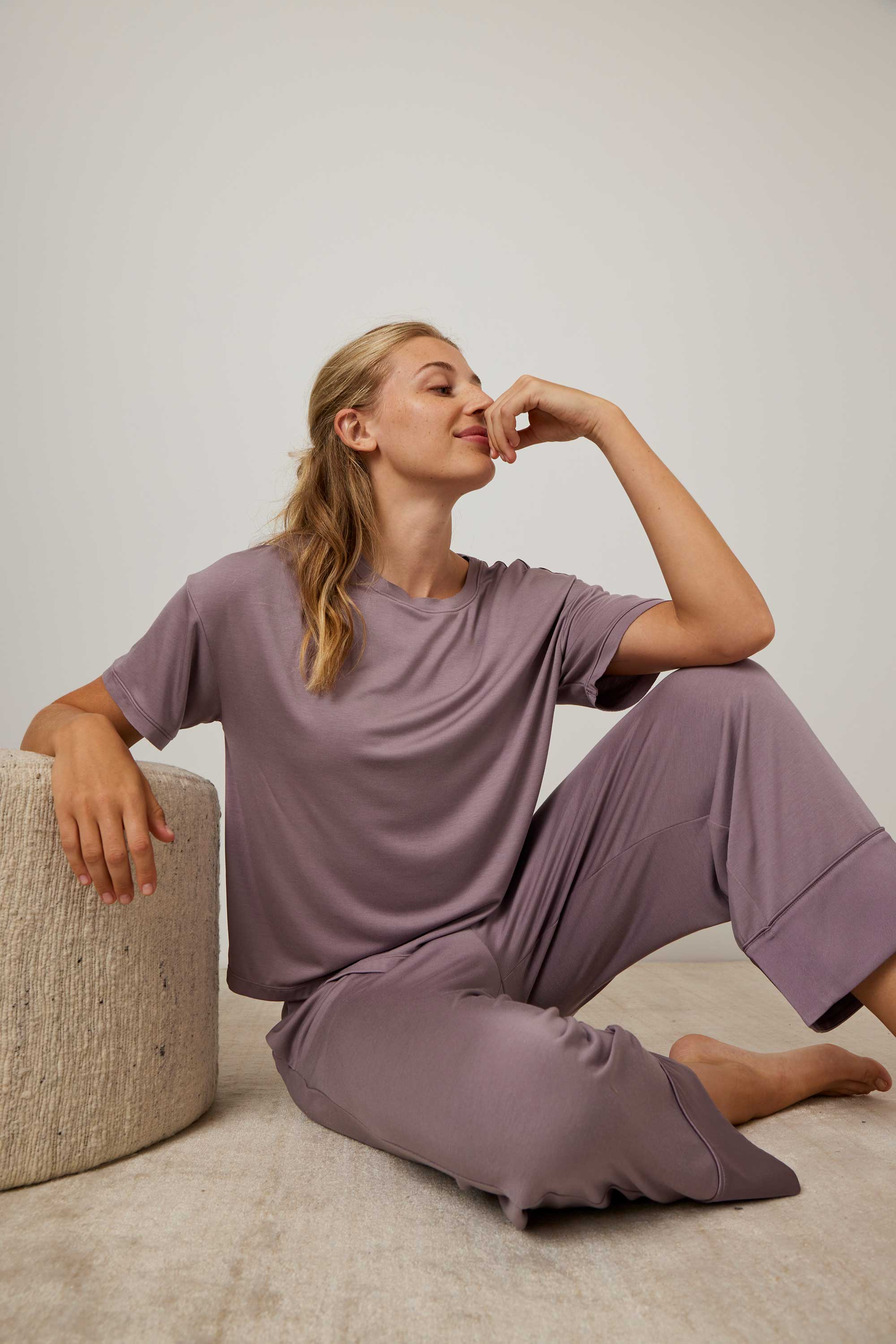 woman in purple pajama t-shirt and matching pants