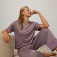 woman in purple pajama t-shirt and pajama pants