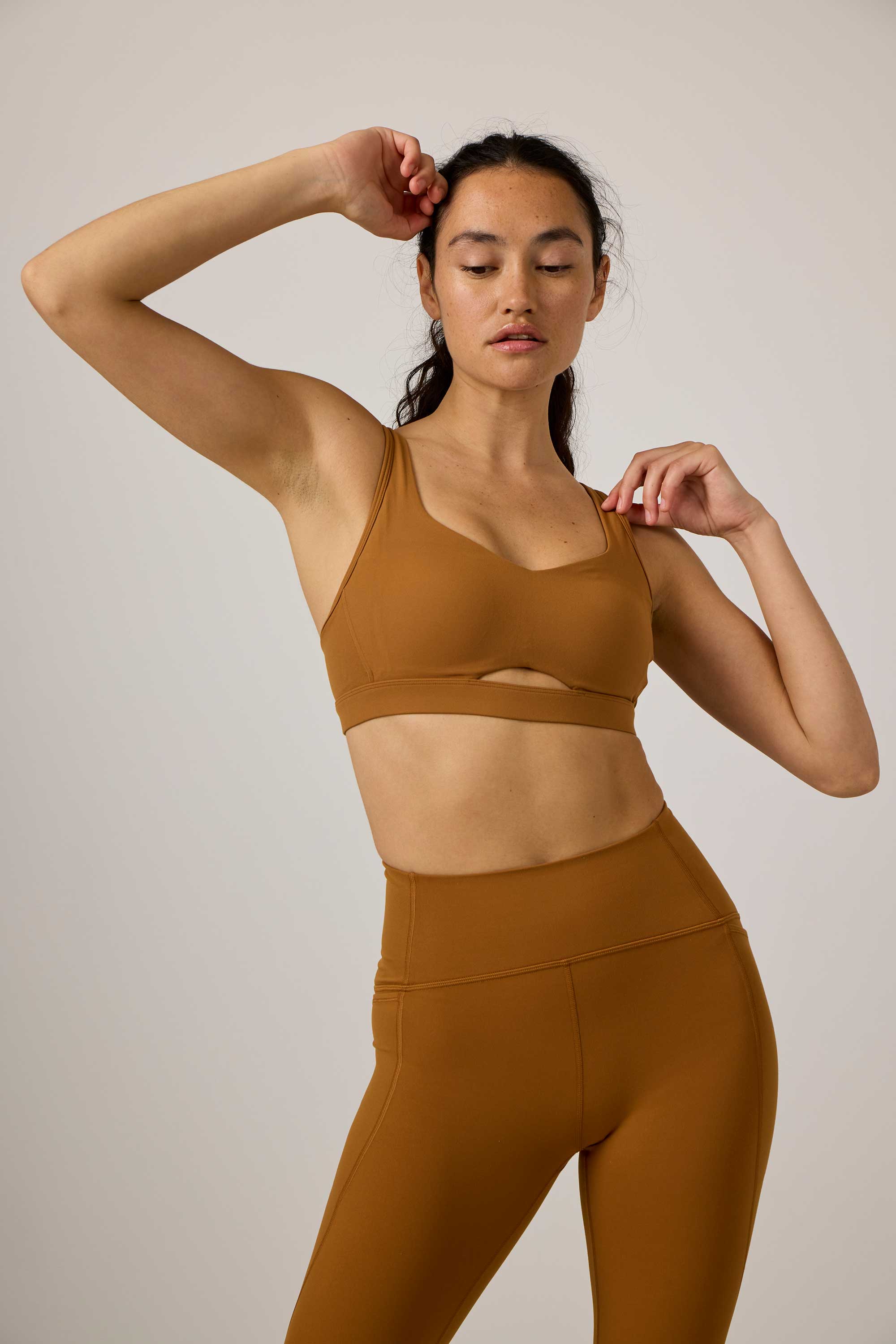 woman in yellow sports bra and leggings
