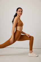 woman in mustard sports bra and leggings