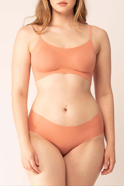 woman in maple syrup color bra and brief