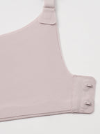 Closeup of light nude colored bra clasps.