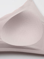 Close-up of a beige bra on a light gray background