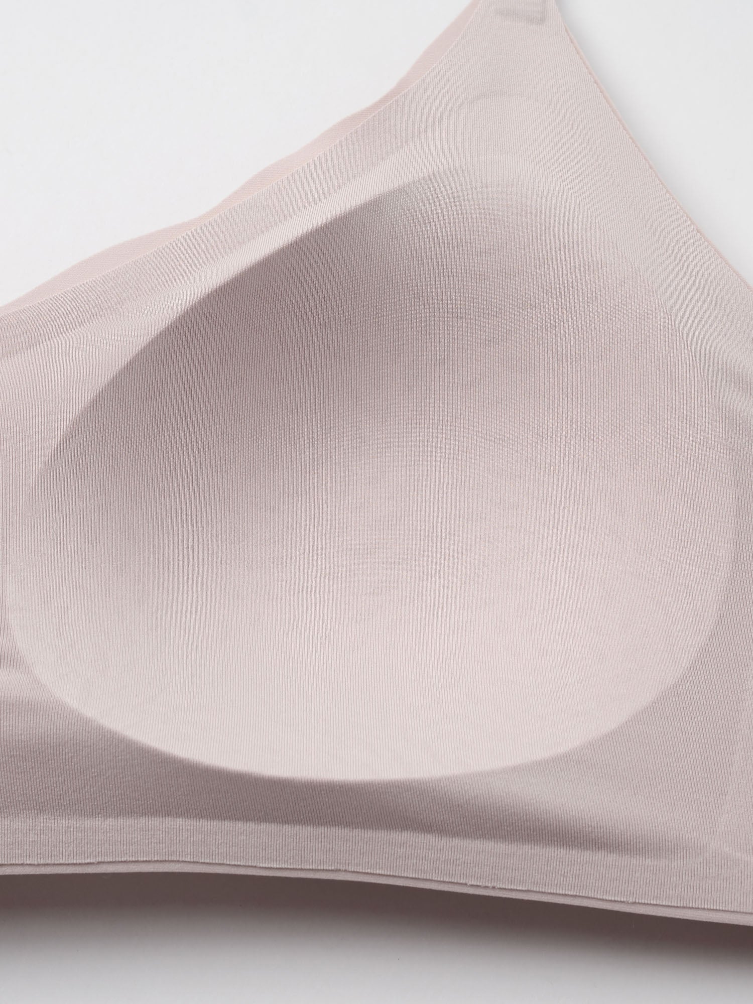 Close-up of a beige bra on a light gray background