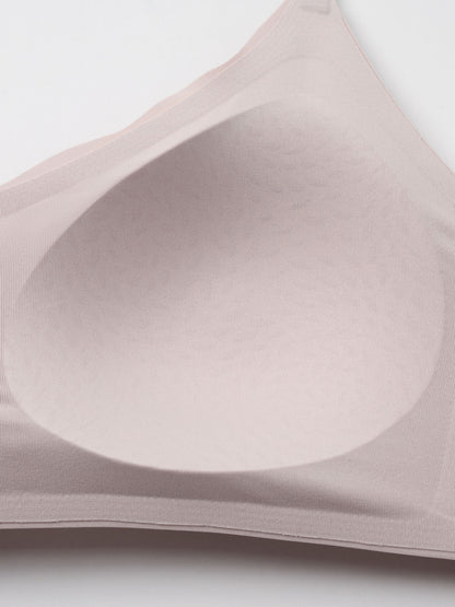 Close-up of a beige bra on a light gray background