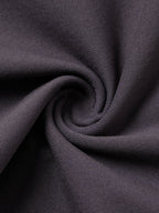 Close-up of dark gray fabric with folds
