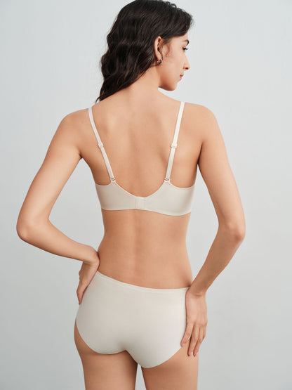 Back side of model wearing a light cream colored bra and brief set