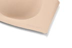 Close-up of a beige wireless bra cup with the brand name 'Barely Zero' subtly embossed on the side, set against a clean white background.