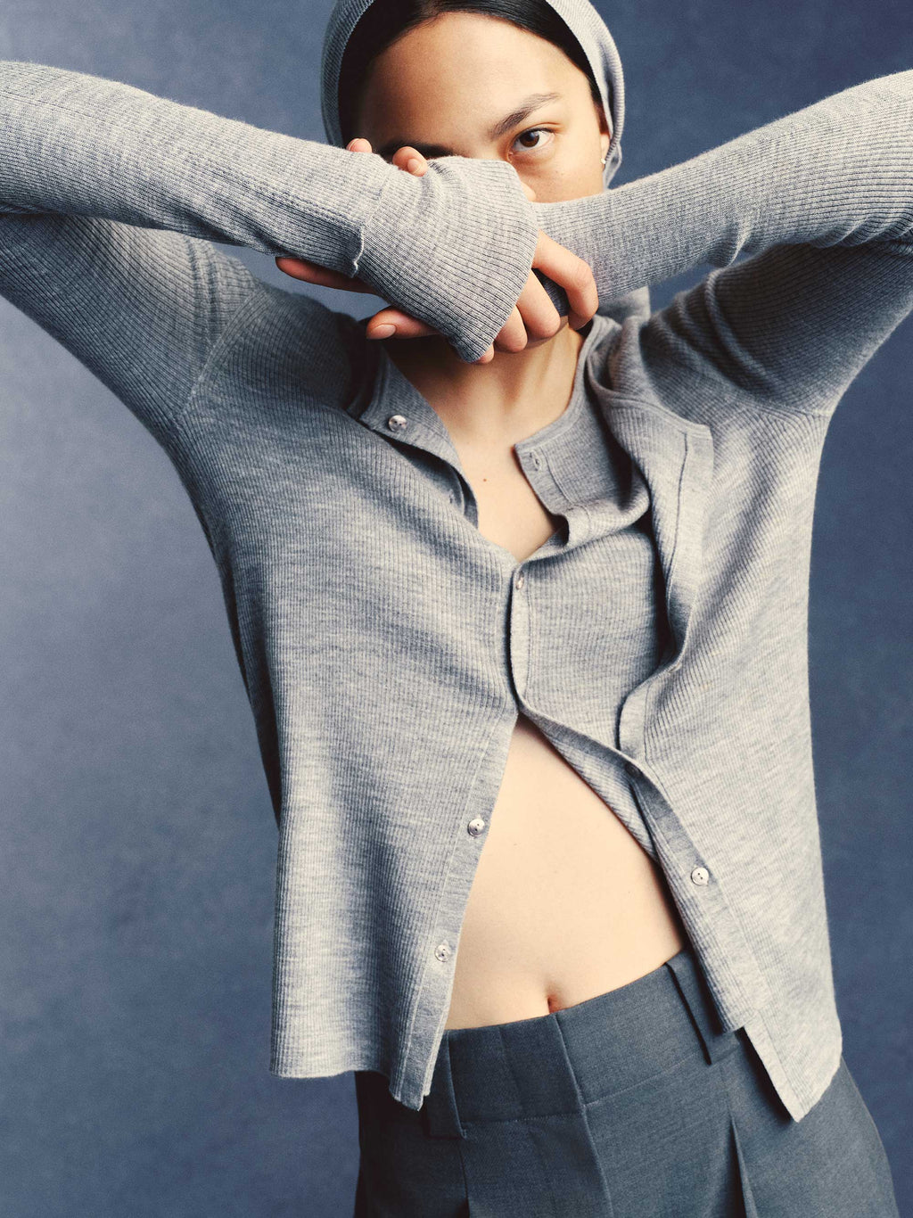 woman in grey cardigan