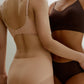 Woman wearing peach-colored underwear and woman wearing brown underwear