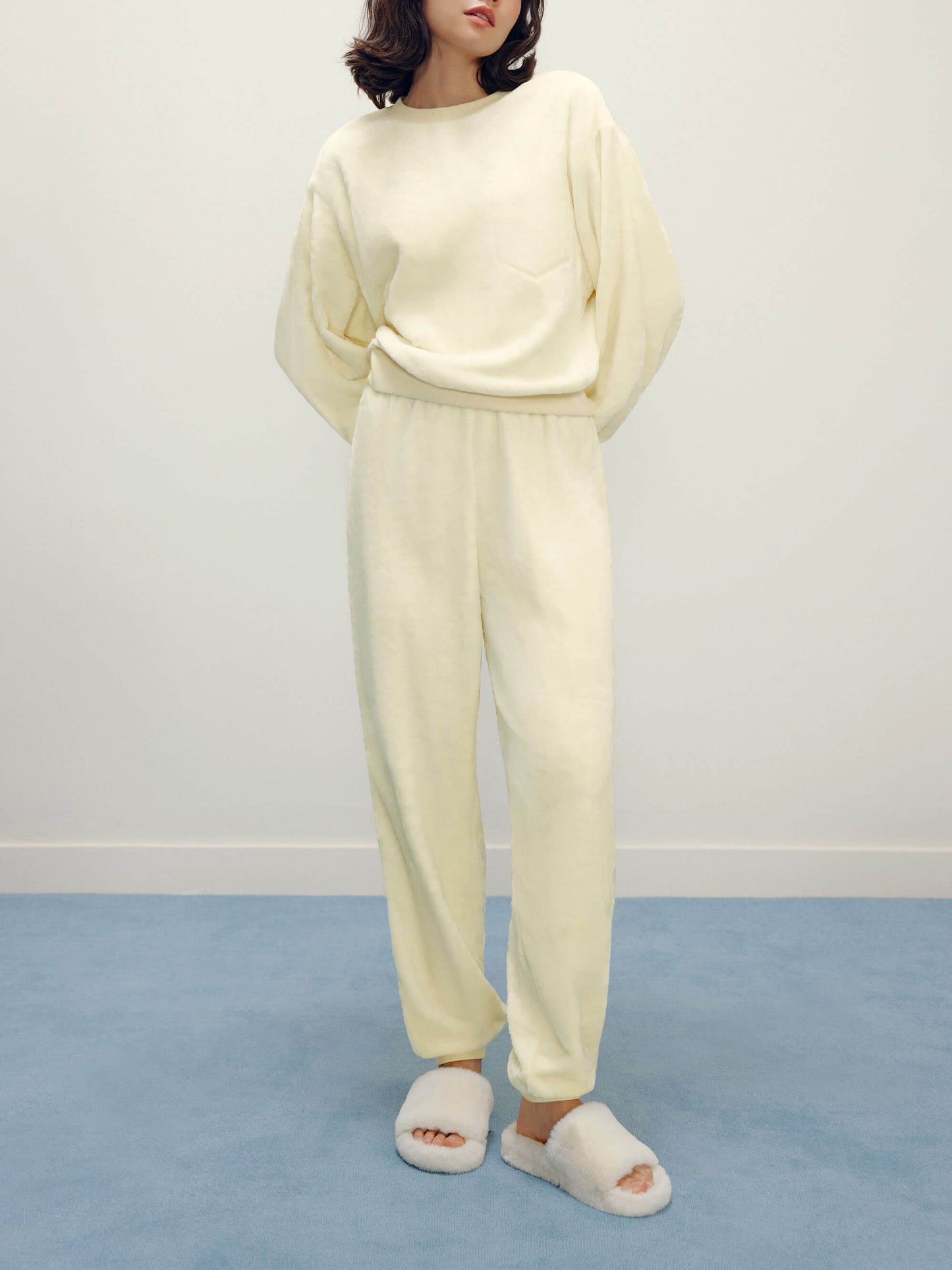 Women with cream color fluffy loungewear set