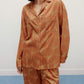 woman wearing brown pajama set