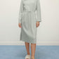 woman in mint pajama lounge sleeve dress with waist drawstring