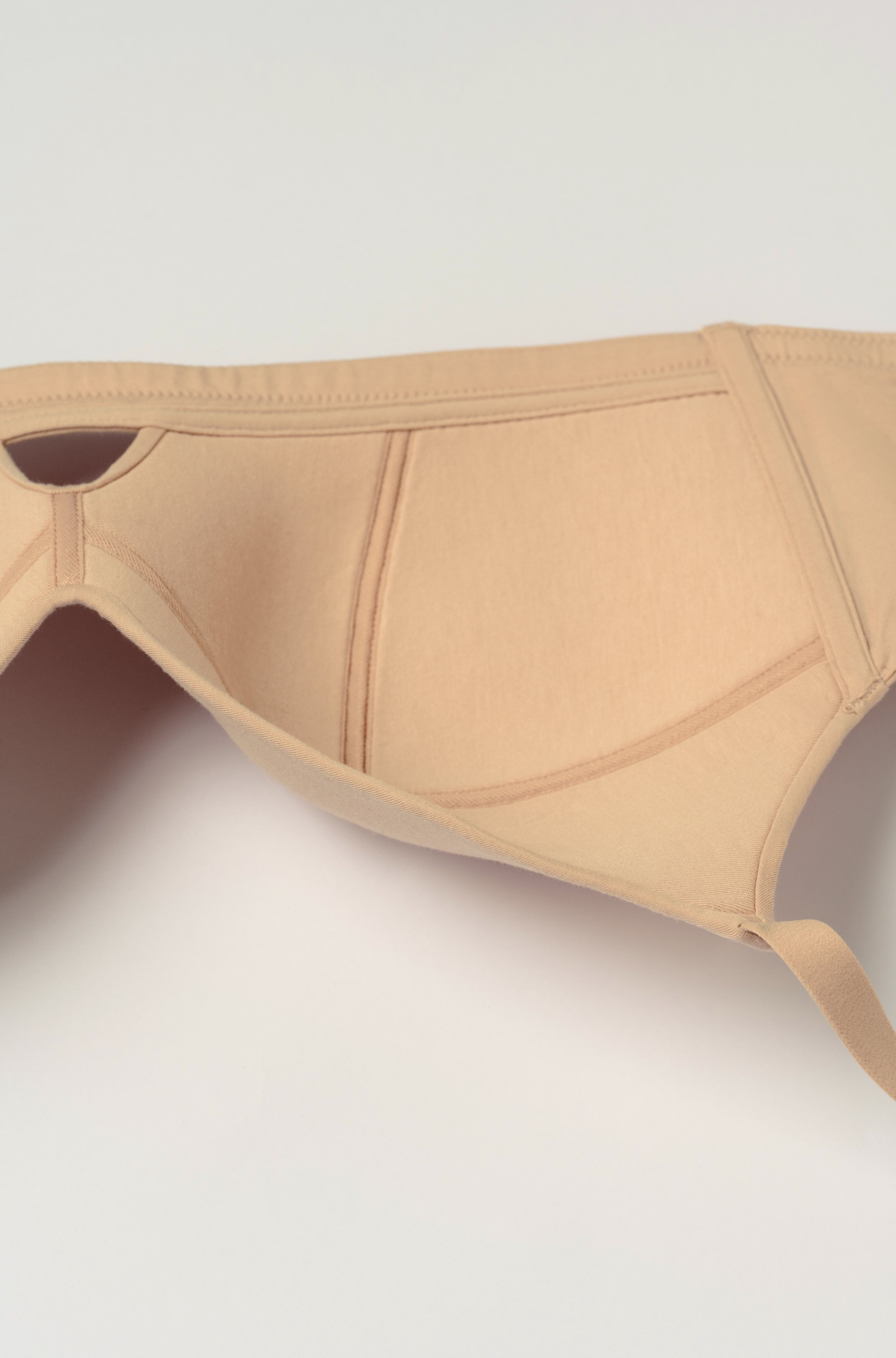 Beige bra on a white background