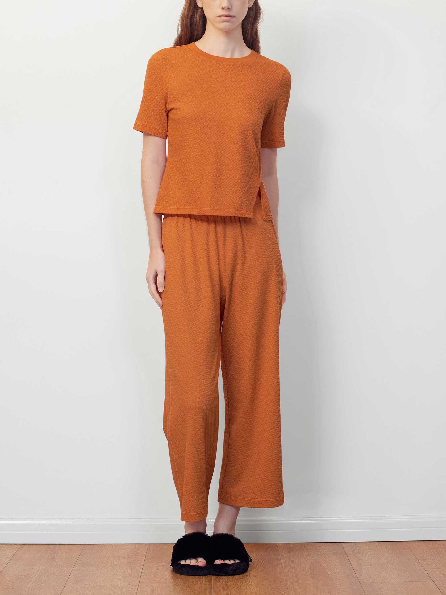 woman in orange T-shirt and pants