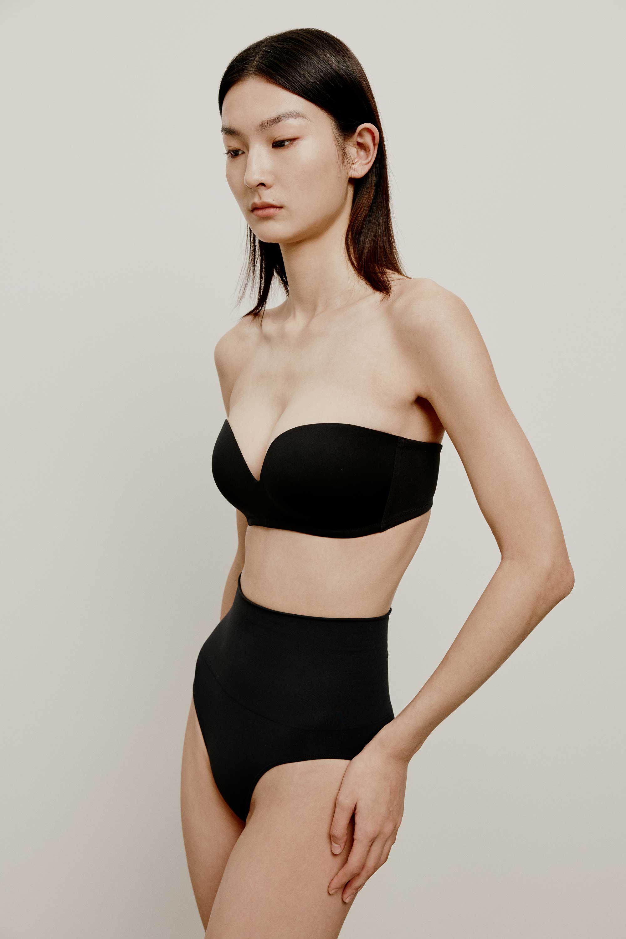 woman in black strapless bra and black brief