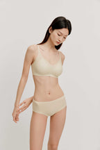 woman in light yellow bra and brief