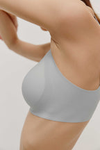 side of woman in light blue bra