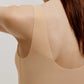 back of woman in beige bra