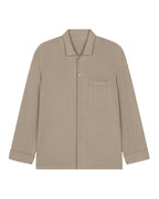 flat lay image of tan pajama button up shirt