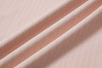 close up of pink cotton fabric with ribbed details