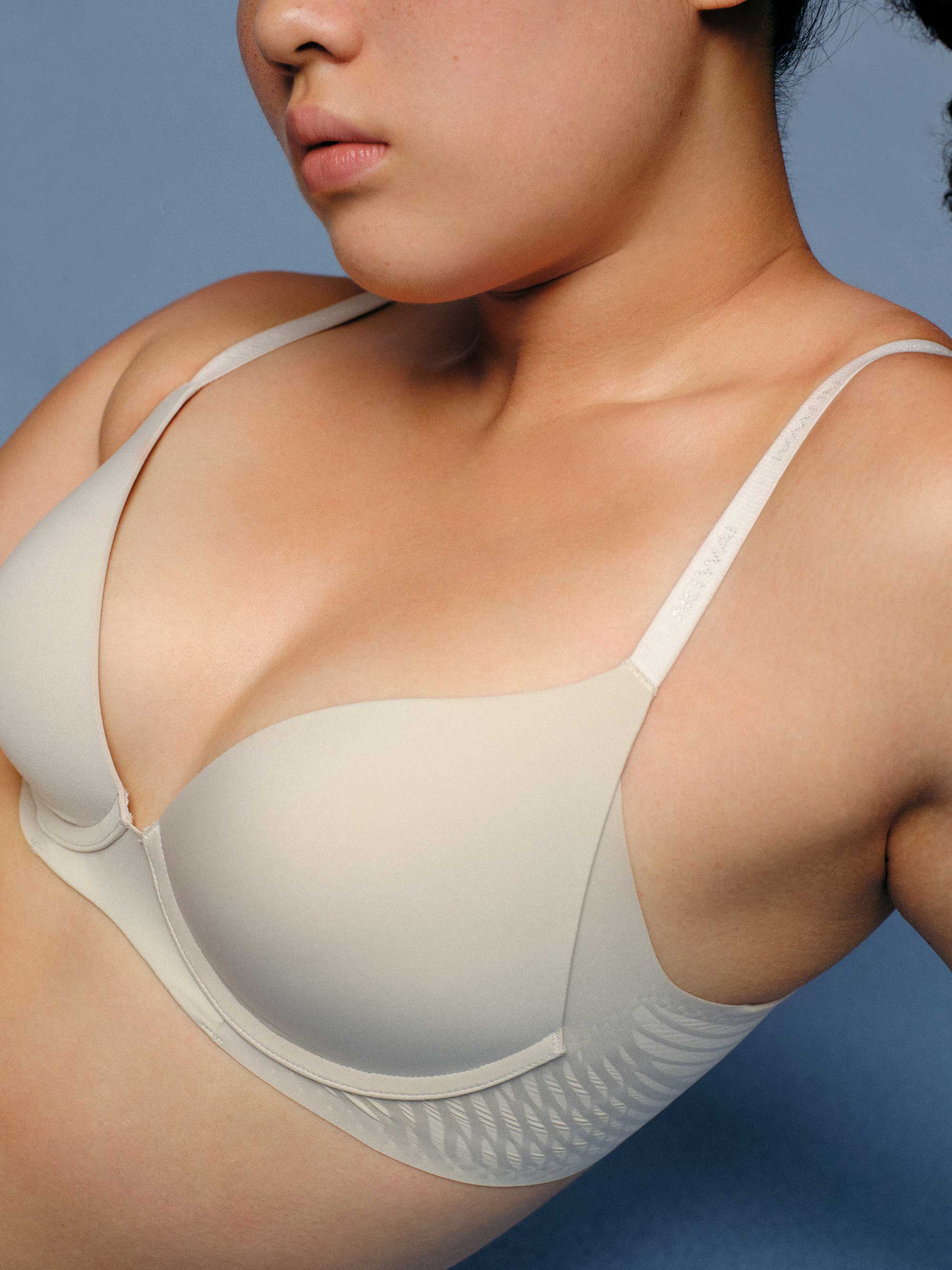 Woman wearing cream bra