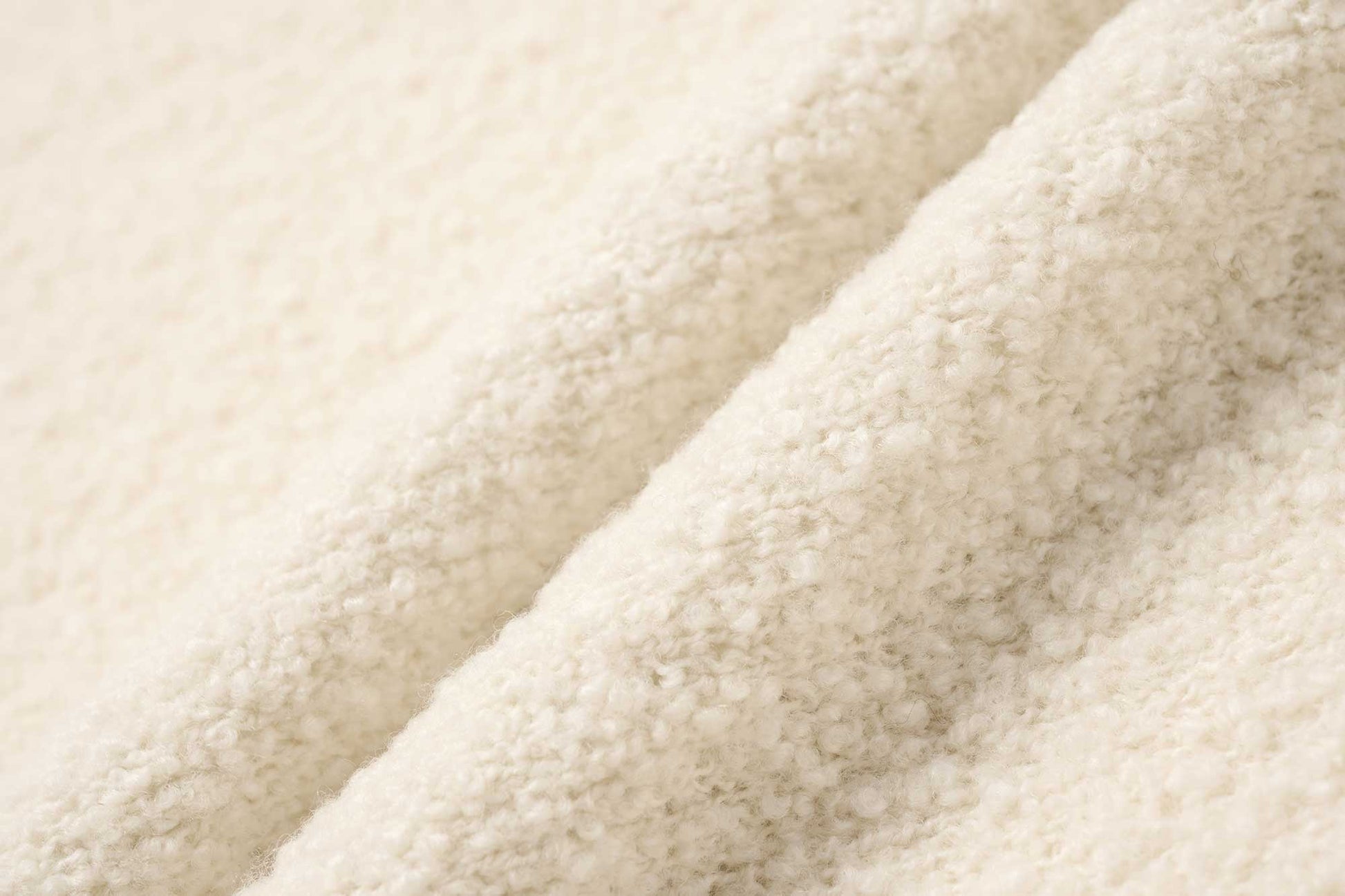 fabric detail of white cardigan 
