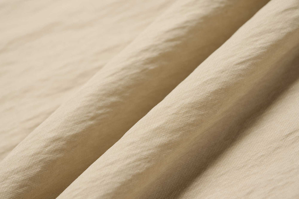 fabric details of yellow trousers
