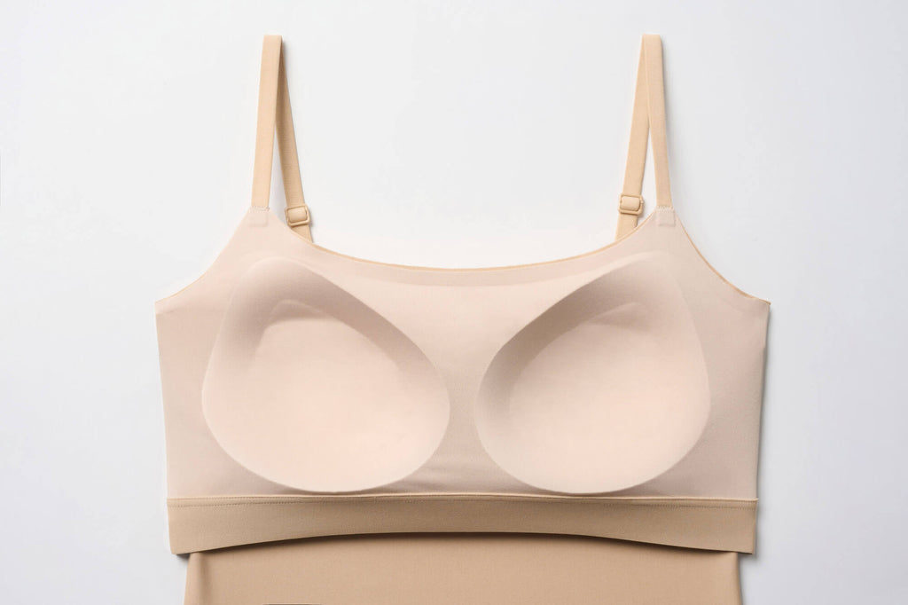 Interior view of built-in shelf bra of beige camisole