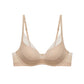 Product image of a nude 3/4 cup bra with adjustable straps and mesh detailing, displayed on a white background.