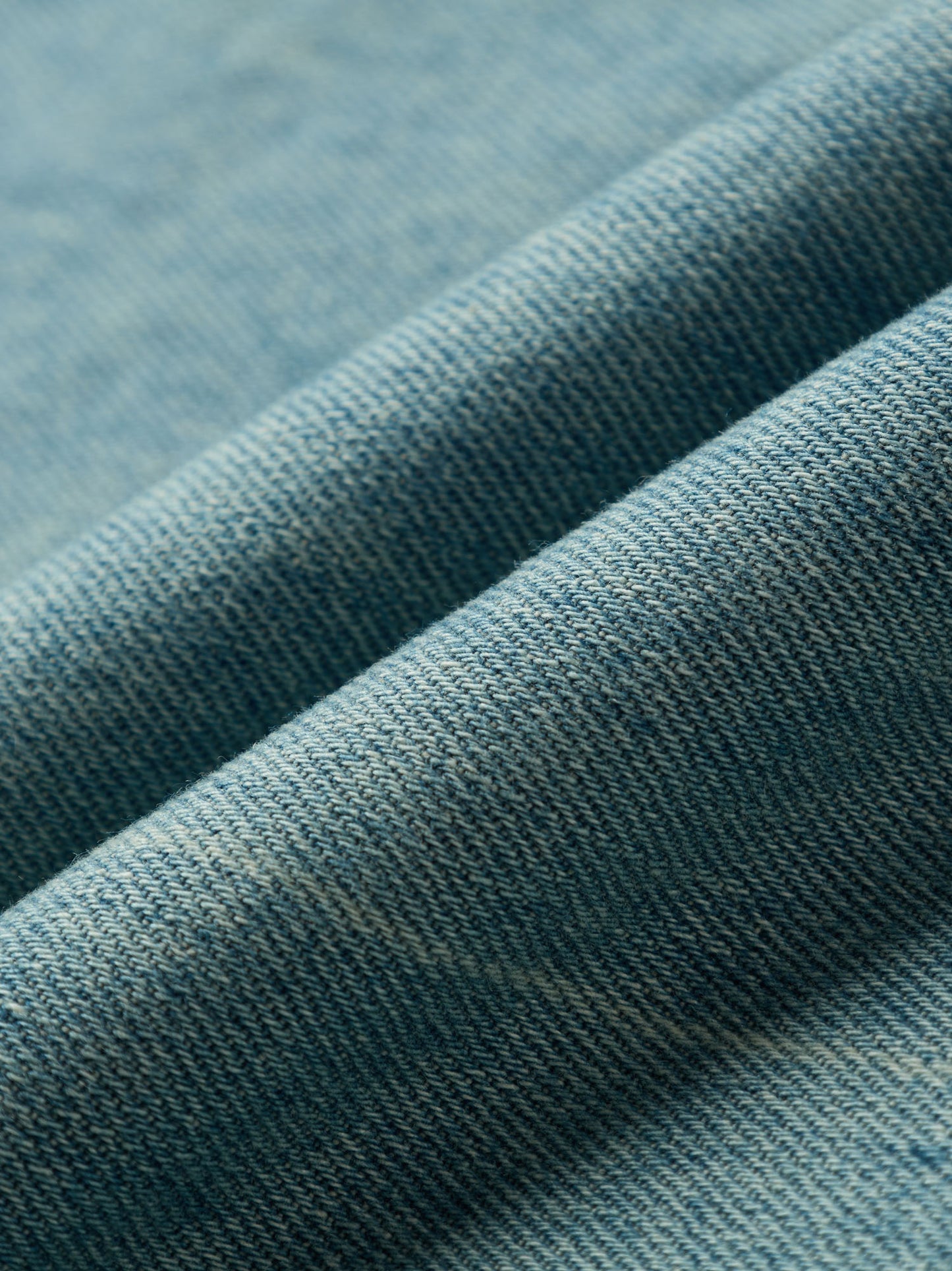 Close-up of light blue denim fabric 